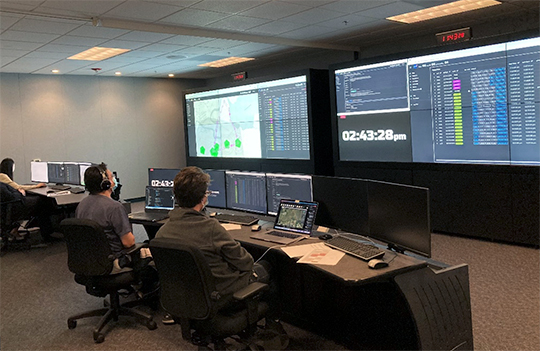 Researchers in the Airspace Operations Laboratory participating in the Advanced Onboard Automation (AOA) simulation