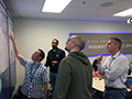 Click to see an image of the AOL Advanced Air Mobility (AAM) Project Team planning a simulation