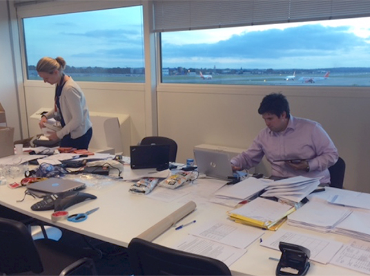 Two of the airline FRMS team preparing for the study at the airport with the experimental breakroom